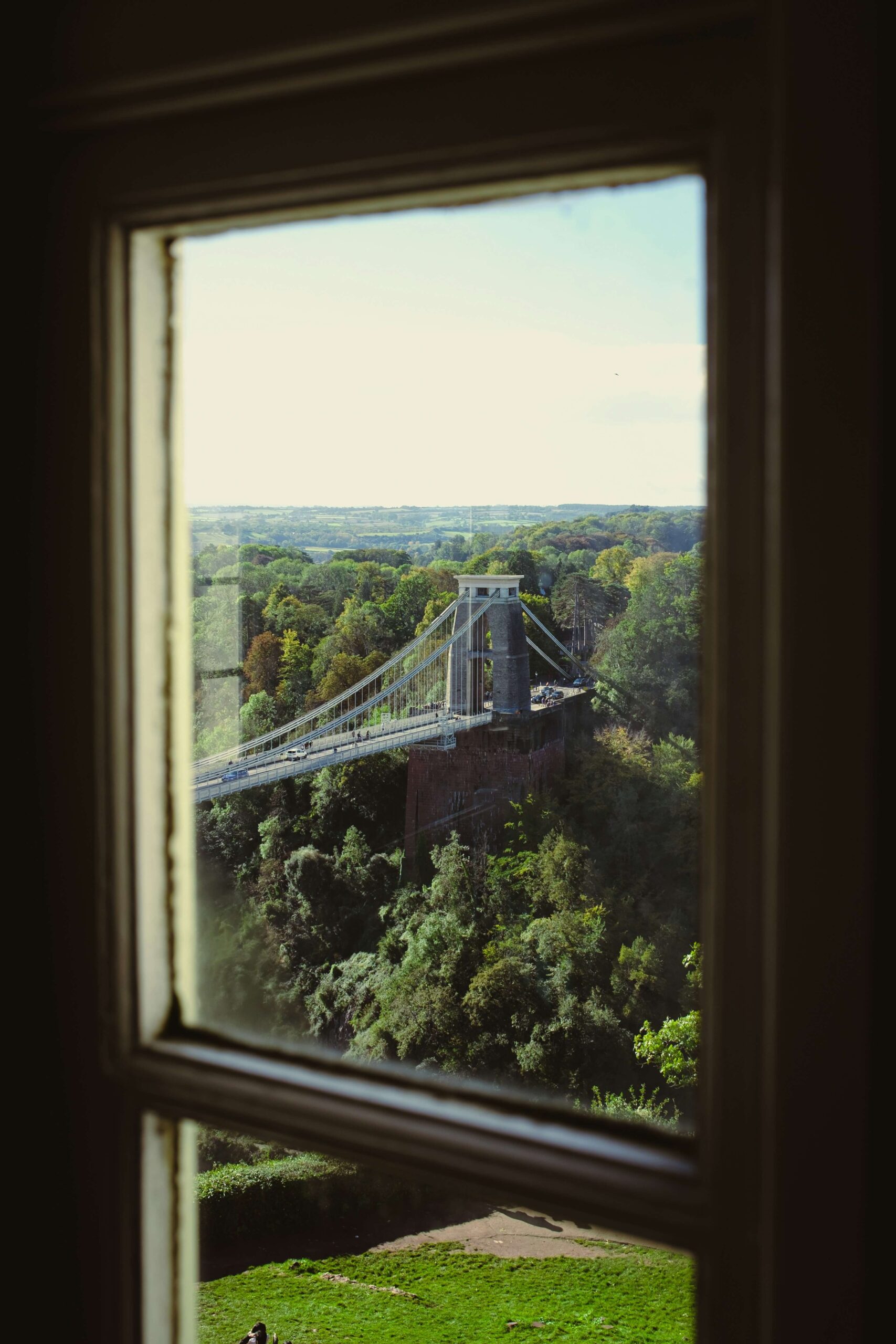 An image of Clifton Suspension Bridge through the window of a local house.