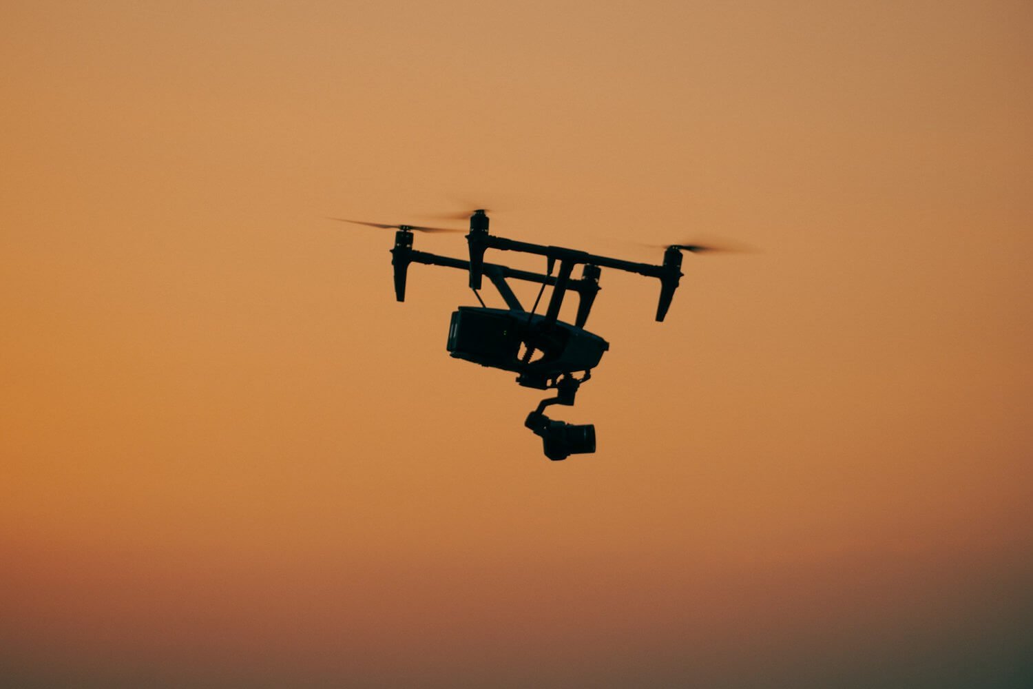 An image of a DJI drone flying over the skyline of London.