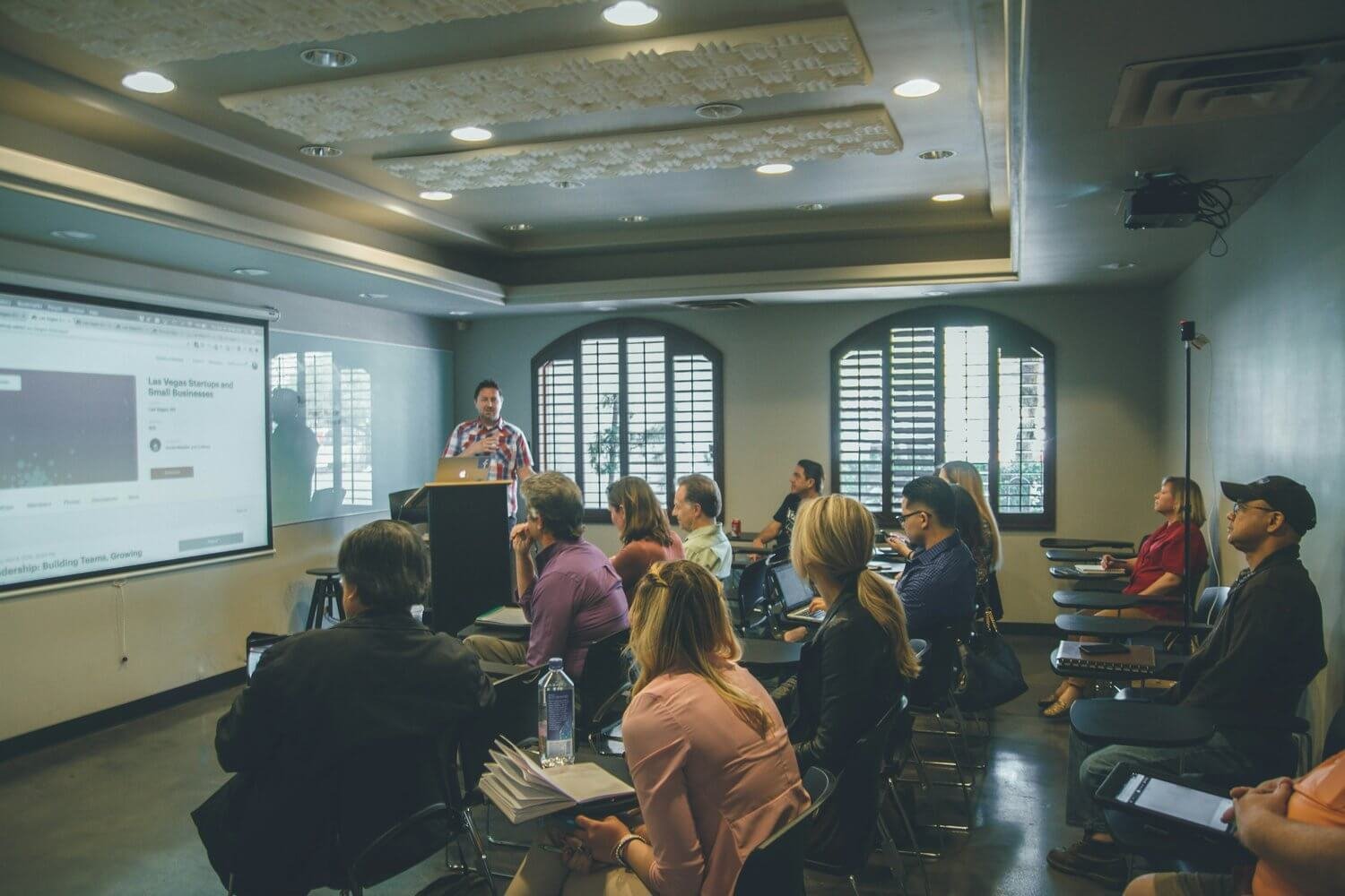 A class room of filmmakers learning how to improve their sustainability.