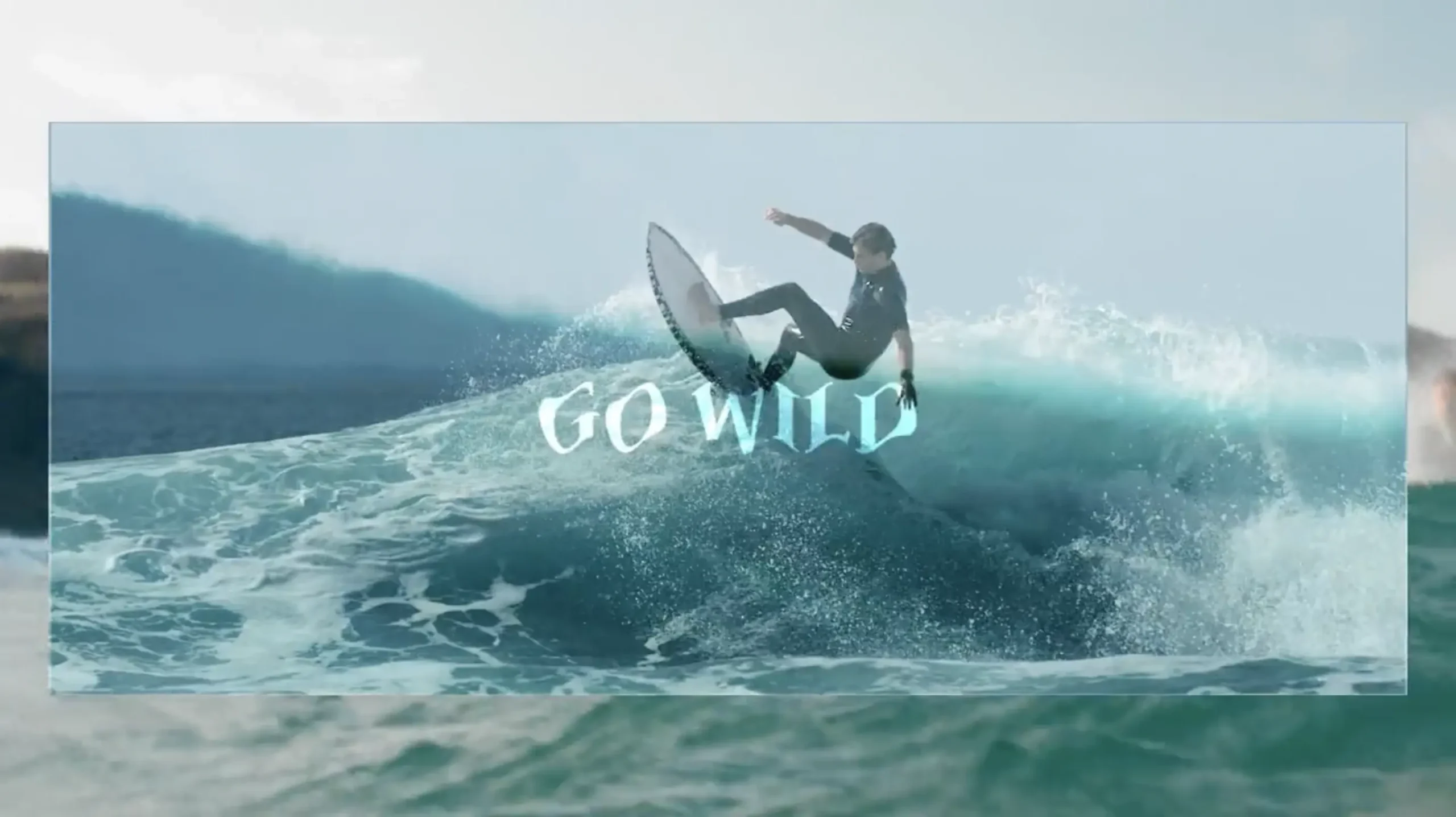 An image of a surfer on a wave with the words "go wild" on screen.