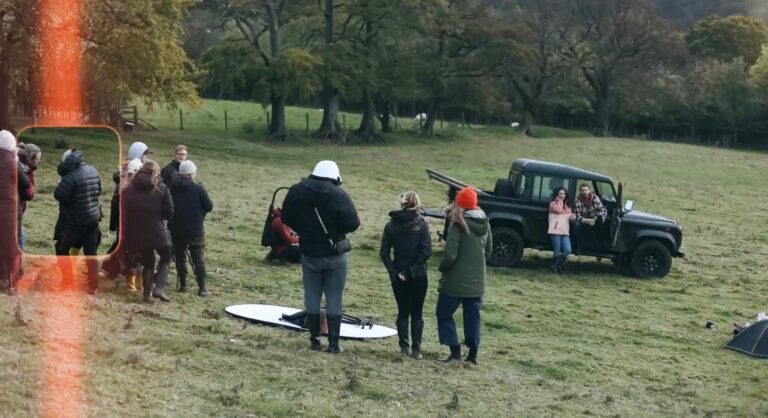 An image the FatFace film crew in a field filming a TV commercial.