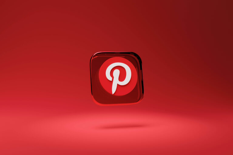 A red Pinterest logo in front of a red background.