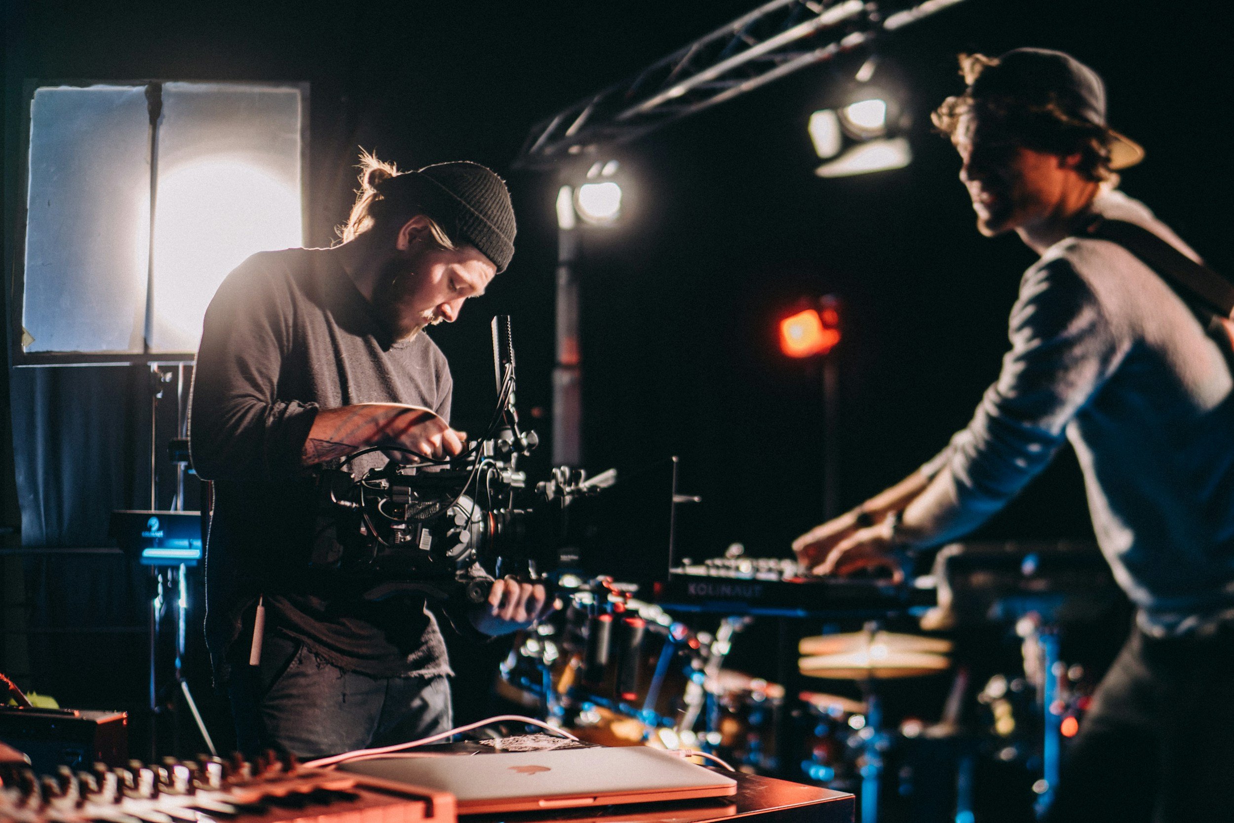 An image of a Director of Photography getting his kit ready on a table.