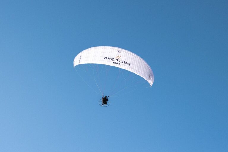 An image of the Turner Twins in the sky flying an electric Paramotor.