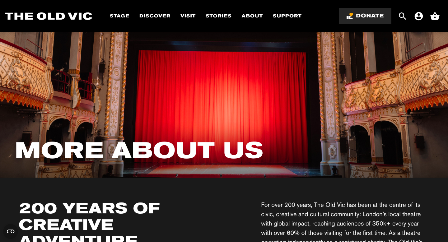 A Screen shot of the website for the Old Vic in Bristol. There is a clear image of the stage with the red curtain pulled behind.