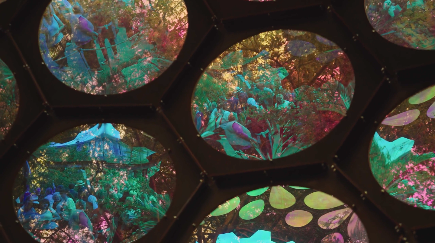 An image of the inside of an exhibit at the Chelsea Flower Show. You can see large reflective panels made to look like an insects eye.