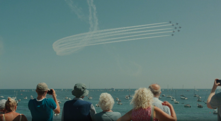 An image of the red arrows flying above the heads of onlookers at the National Armed Forces Day.